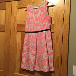 Coral and tan dress with black ribbon waist